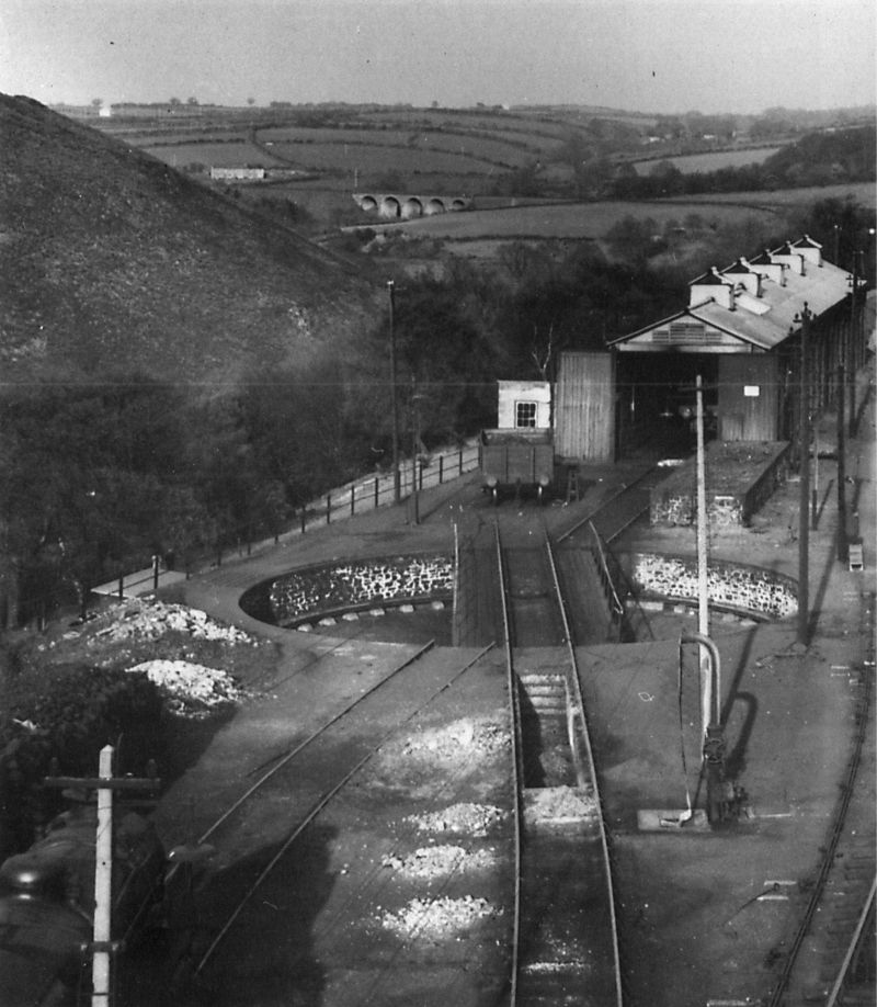 Terrific 'Cam' Camwell 1938 view from the tall starting signal post, showing the 50' turntable and locomotive shed at Okehampton. Fatherford Viaduct in the background. Reproduced with permission from Branch Line to Bude published by Middleton Press 01730 813169, middletonpress.co.ukbrPhotographer W A Camwell