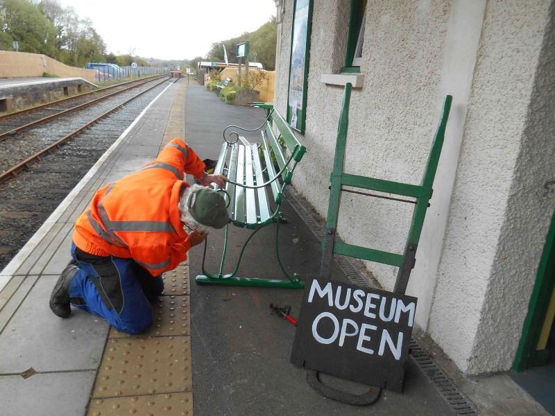 Tom Baxter at work on the ironwork of one of the seats