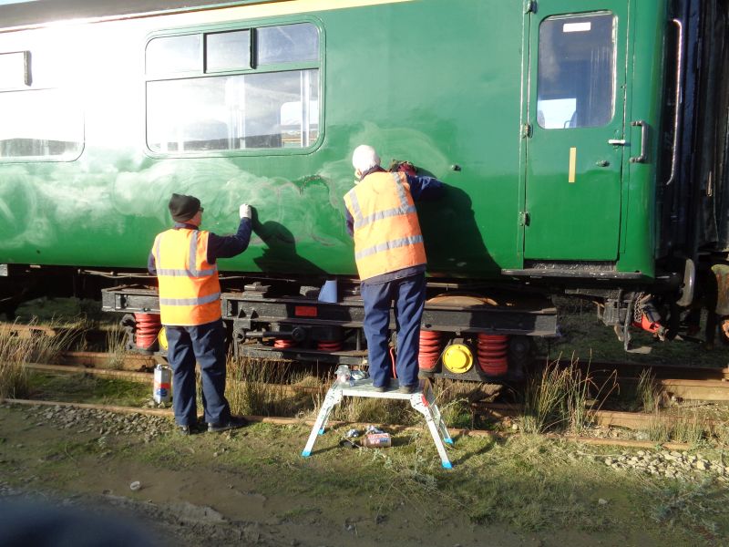 With aid of a special thinners Ron Kirby and John Coxon scrub off graffiti in the sunlight - the latter soon disappeared as forecastbrPhotographer David BellbrDate taken 10012019