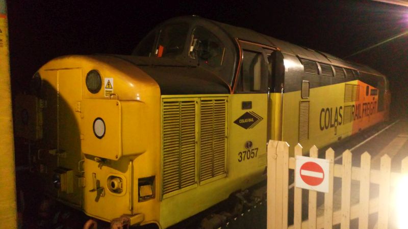 The much travelled, long lasting stalwart class 37 locomotive 37057, built by English Electric at their Vulcan Foundry works in Newton-Le-Willows as D6757 in 1962, visited Okehampton late on Thursday Dec 19th 2024 while working the 2220 Exeter Riverside Yard and return track testing train via Okehampton, Exmouth and Barnstaple.brPhotographer David EllisbrDate taken 19122024